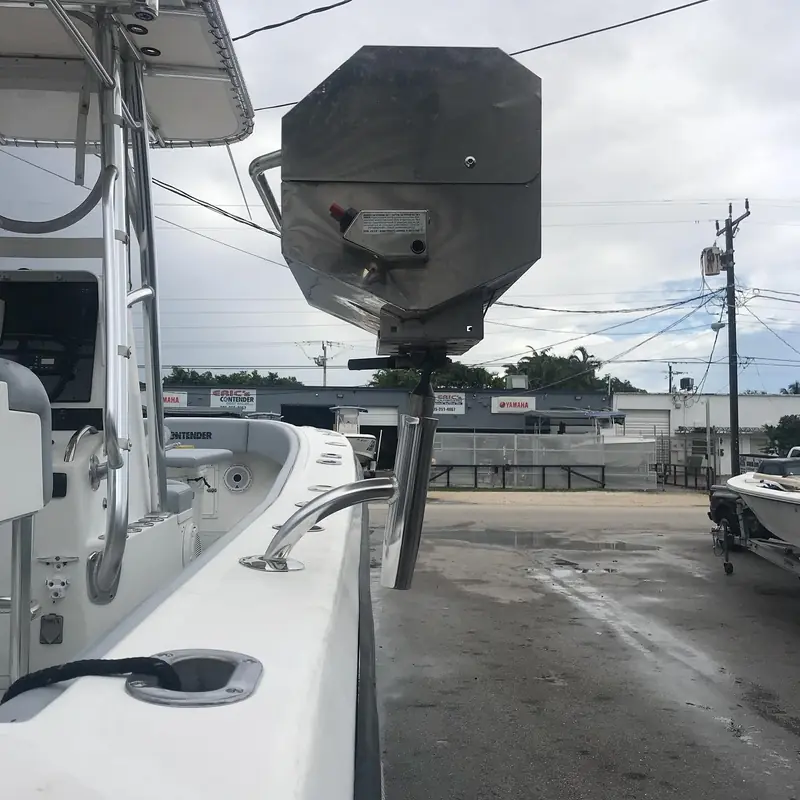 Custom rail mount holding a Magma grill on a boat