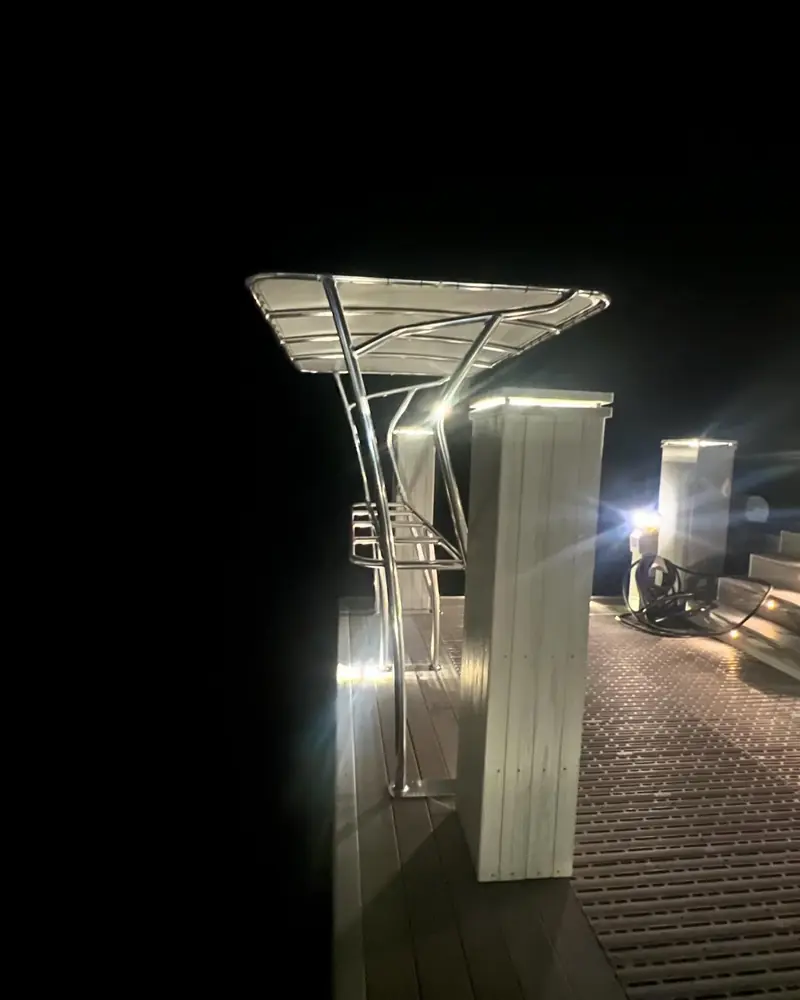 Dock station with a shade over the cutting board, lit at night