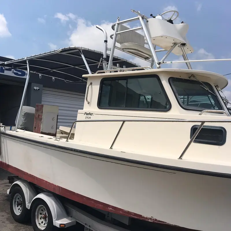Rear shade roof and second station over the helm of a 2520 commercial boat