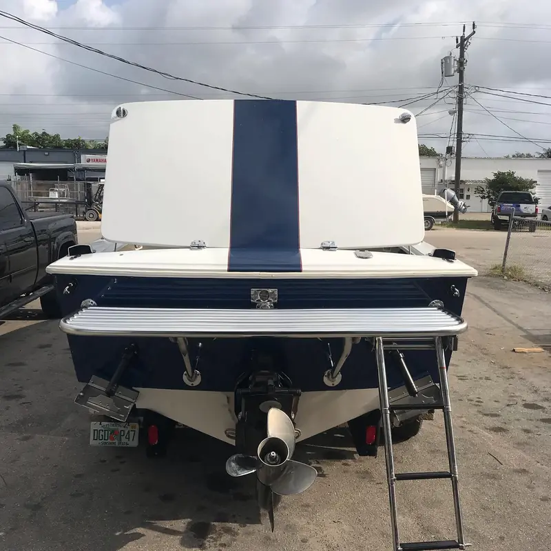 Full-width transom swim platform with ladder on an inboard stern-drive boat