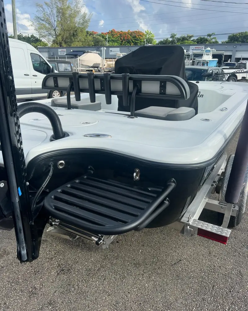 Black swim platform with ladder on a Yellowfin bay boat