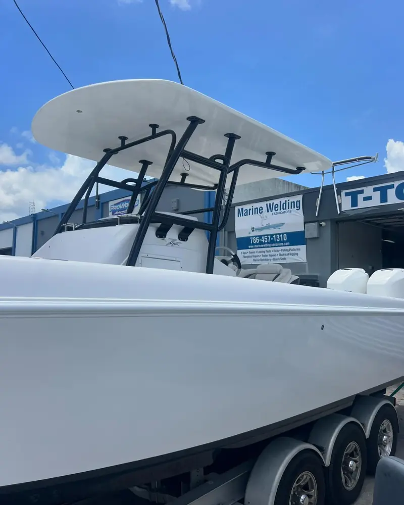 New hard top T-top with black piping on a Donzi center console