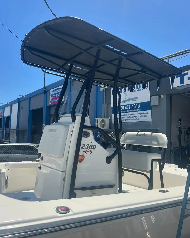 Custom T-top with black canvas and matching leaning post on a 23 ft Pathfinder HPS bay boat