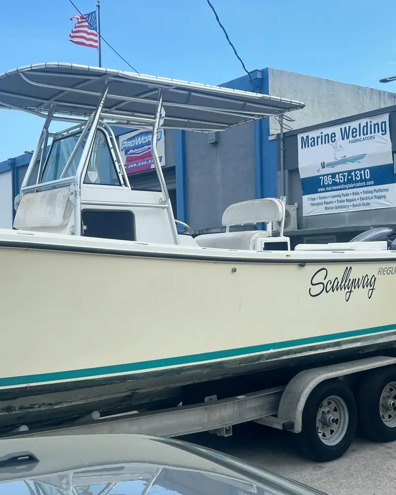 Bare aluminum T-top with gray canvas on a Regulator center console