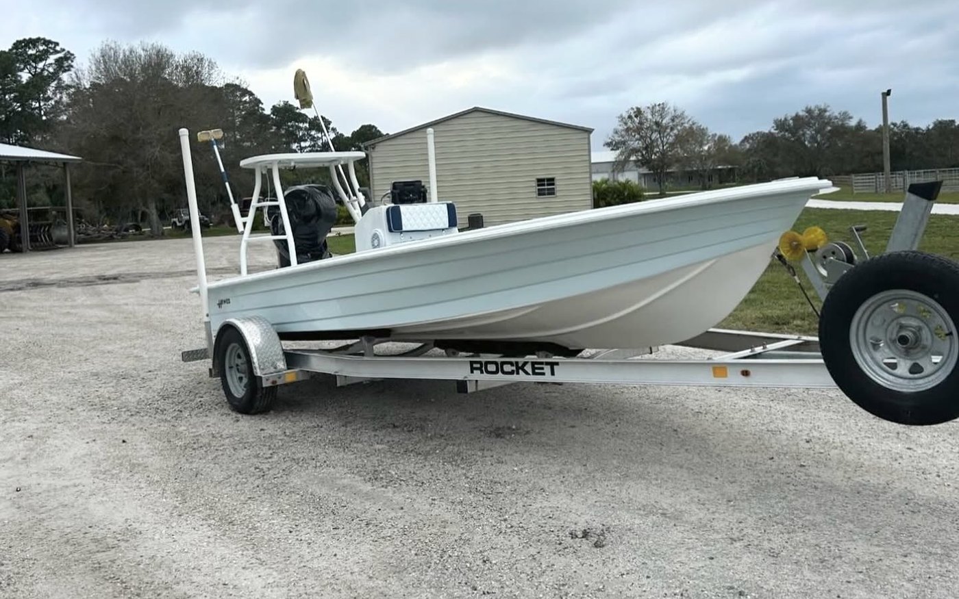 Bay skiff on a Rocket single axle aluminum trailer