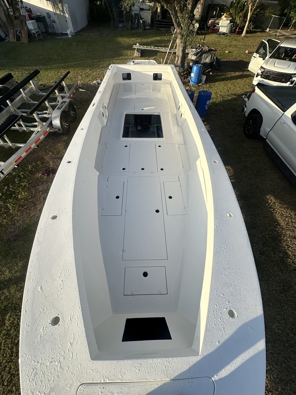 Top-down view of a fully stripped and refinished center console hull